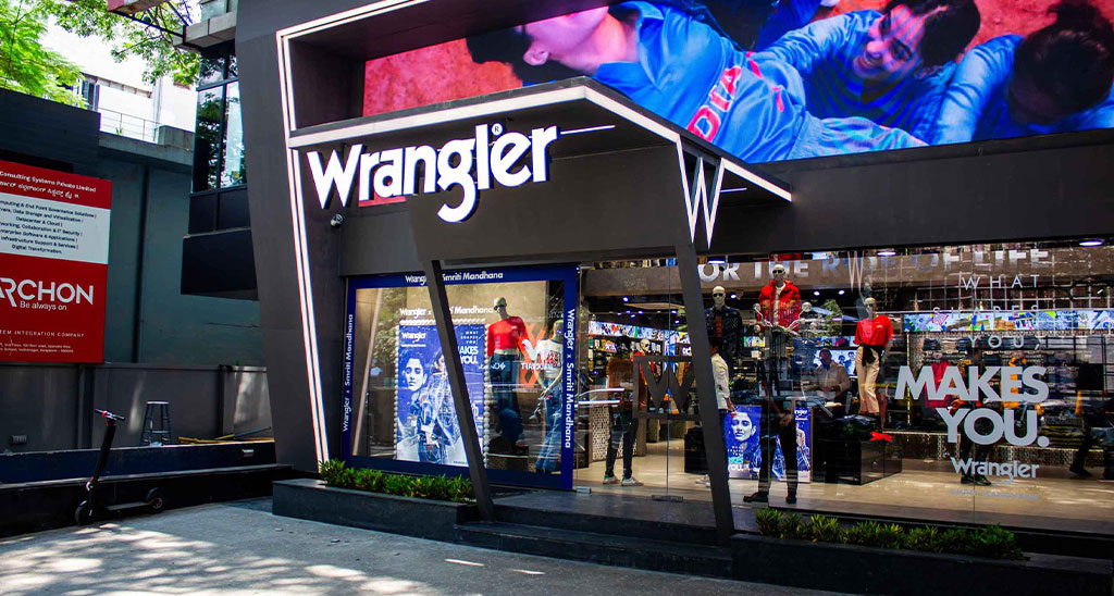 Branded fashion storefront with illuminated digital signage